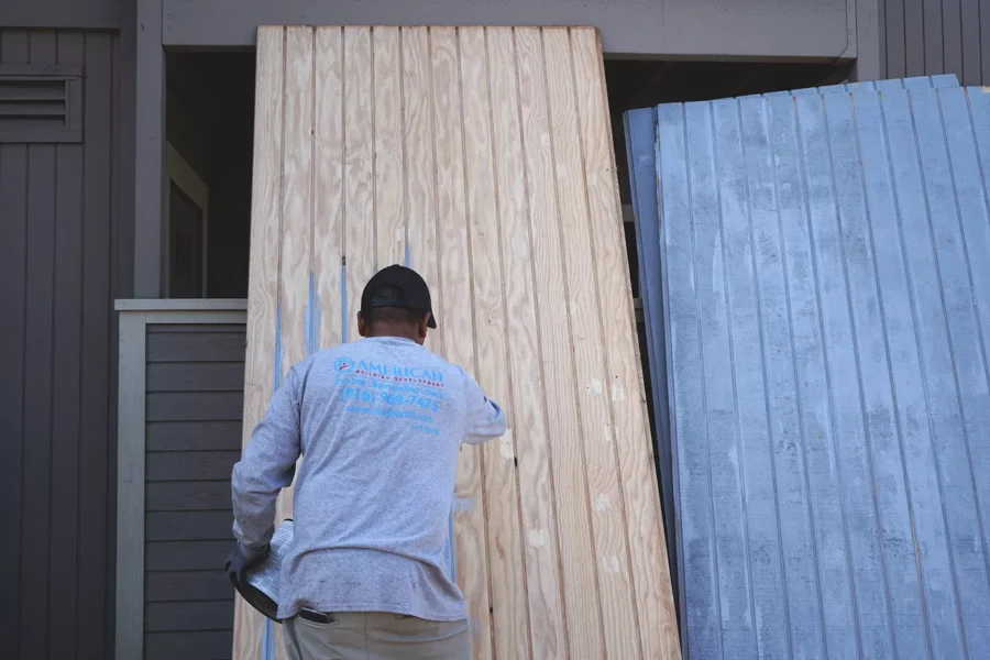 Damaged siding removed to expose wall structure