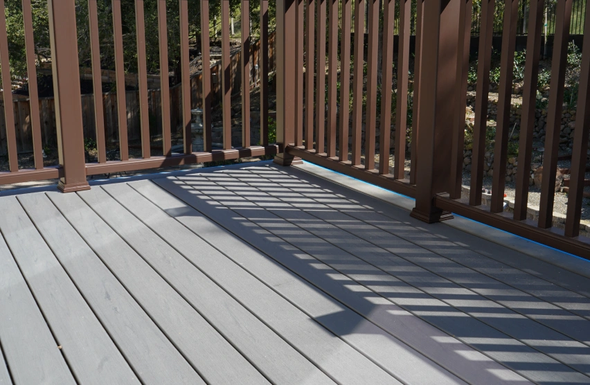 Composite Decks Close-up of composite decking boards showing wood-grain texture and color