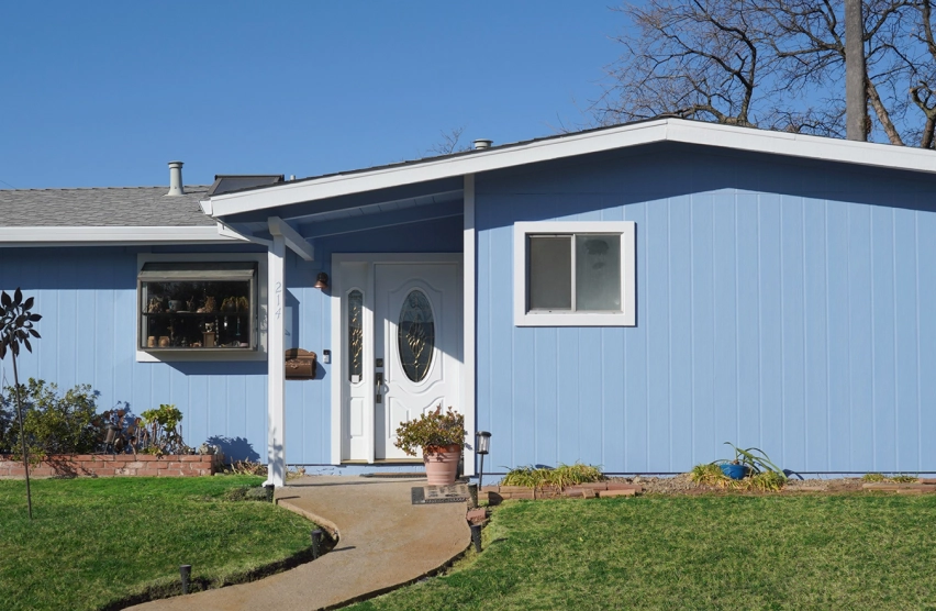 Single-family home with newly installed siding covering the exterior walls