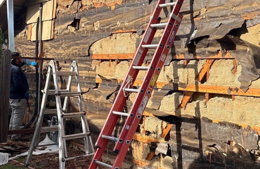 Home exterior inspection for moisture damage and dry rot repair