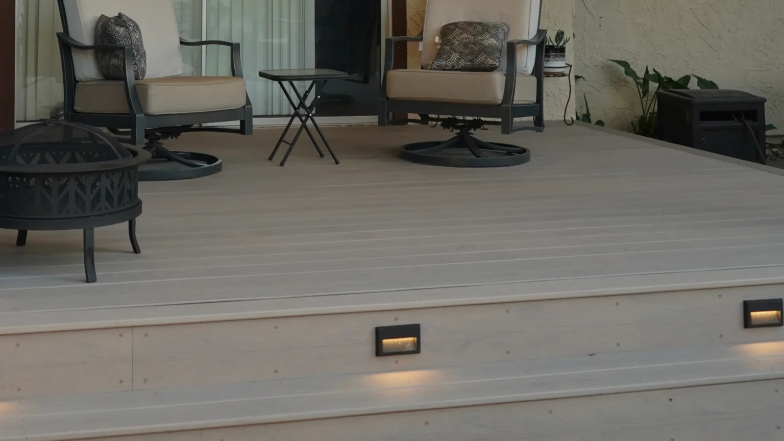 Custom pergola with Trex composite deck and integrated lighting.