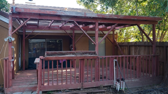 Aging siding, fascia, trim, and window surrounds showing signs of dry rot on an older home
