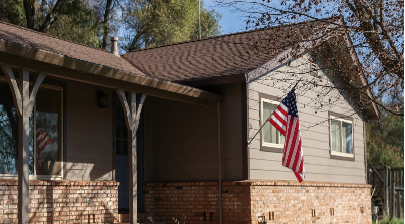 Older residential home with traditional exterior details and mature landscaping