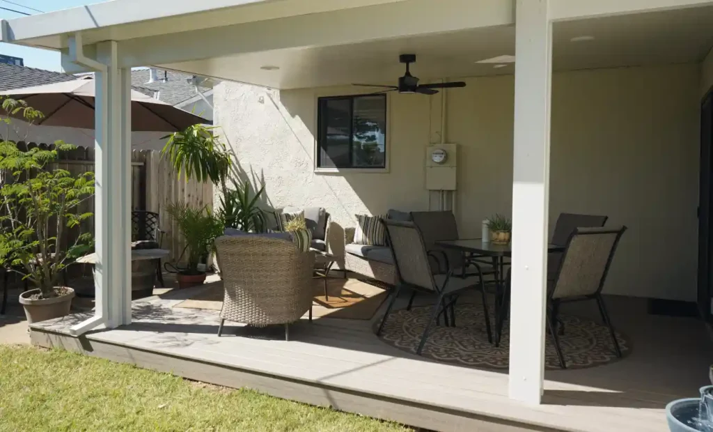 Light-colored composite decking reflecting sun on a hot deck