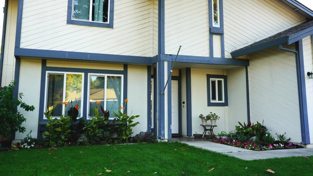 Dry rot damage on exterior siding of an HOA-managed home