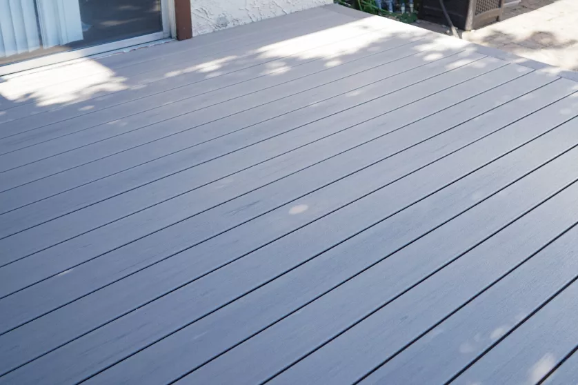 Completed backyard with a custom pergola and Trex composite deck.