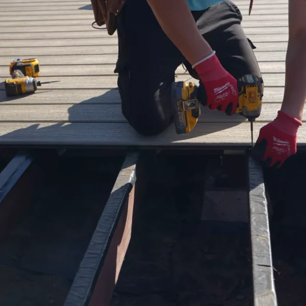 Close-up of the original wood deck framing before removal