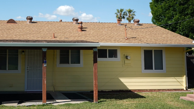 Well-maintained rental property exterior with updated siding