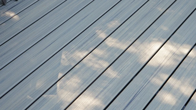 Close-up of composite decking boards showing wood-grain texture and color