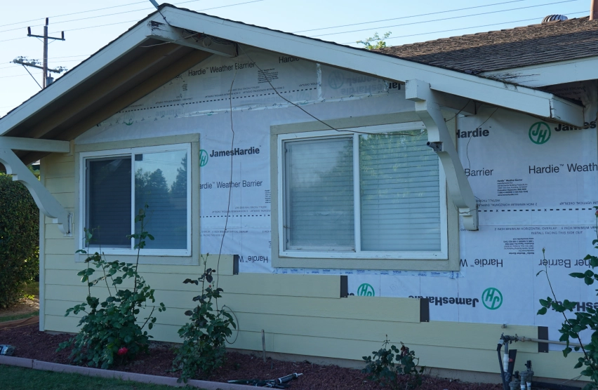 Close-up of siding, window trim, and flashing details on a Folsom home exterior