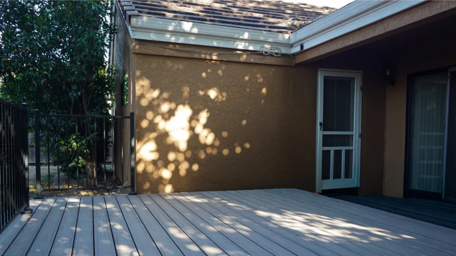 Removal of weathered wood decking during exterior renovation