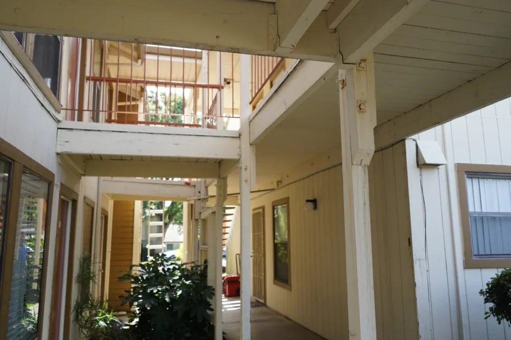 Cutaway view of ledger board water intrusion on elevated deck