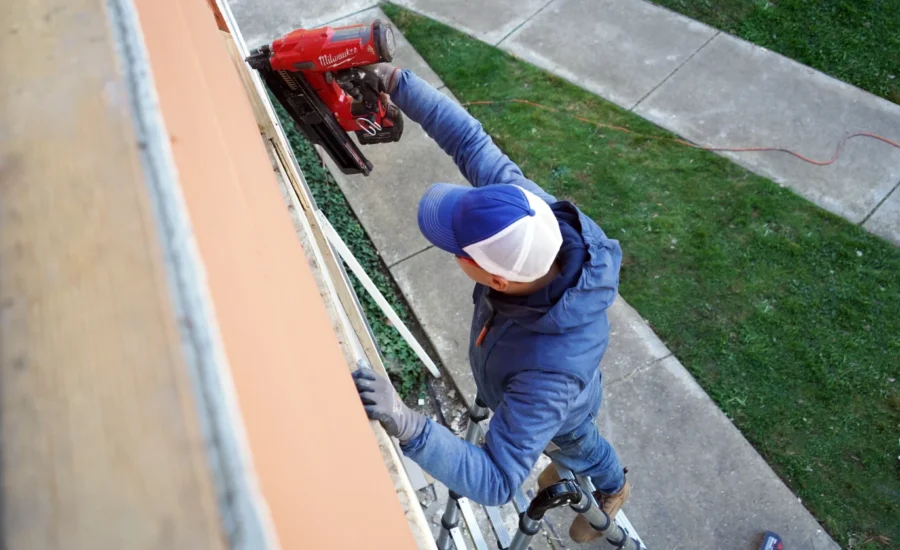 Crew removing the deteriorated wood deck before replacement