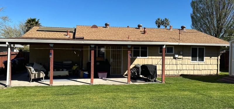 Older Roseville home with wood siding being inspected for dry rot and moisture damage