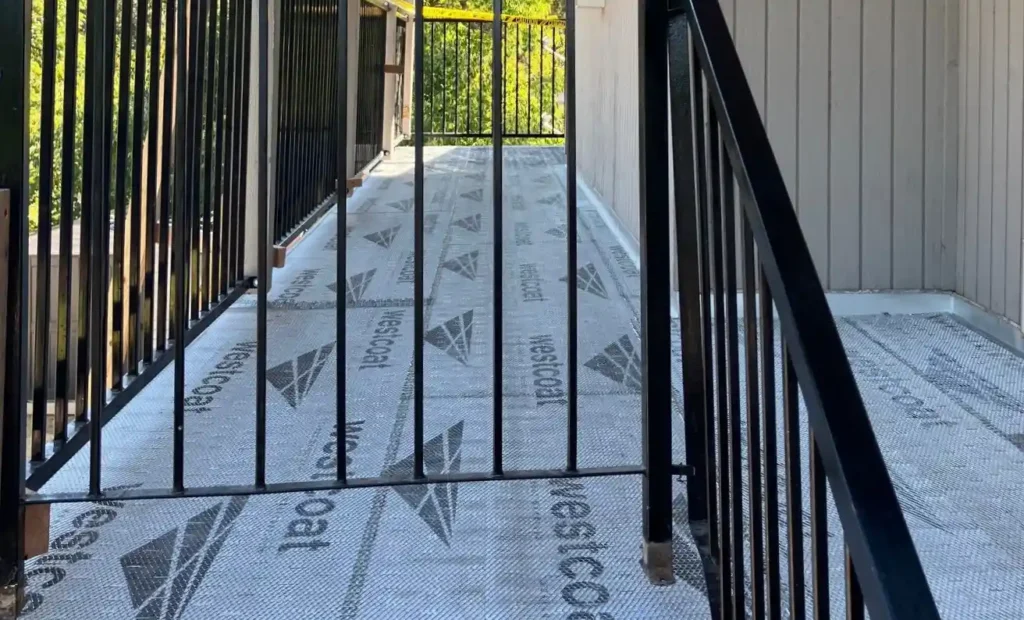 Exploded diagram of deck waterproofing membrane and flashing layers