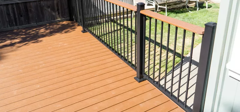 Newly built composite deck with stairs and railing on a Granite Bay home exterior