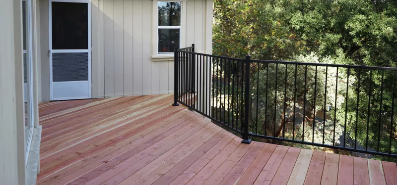 Custom deck overlooking a hillside property with composite decking and modern railings