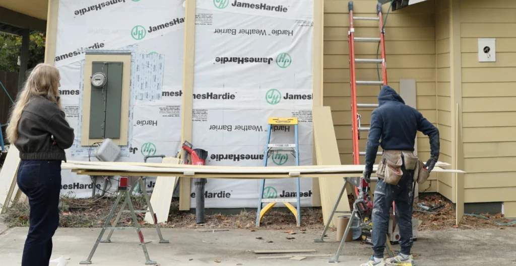 Siding contractor inspecting exterior wall of Citrus Heights home during free assessment