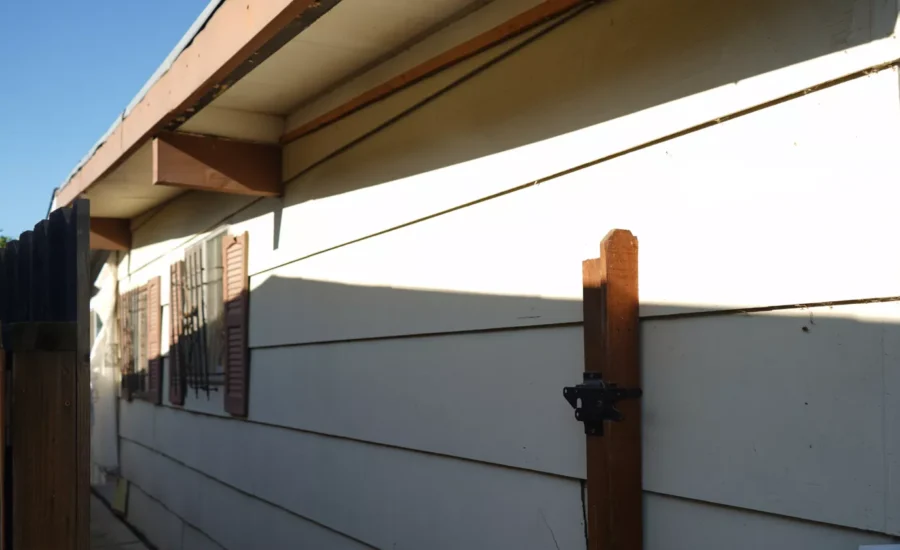 Sacramento home before full siding replacement.