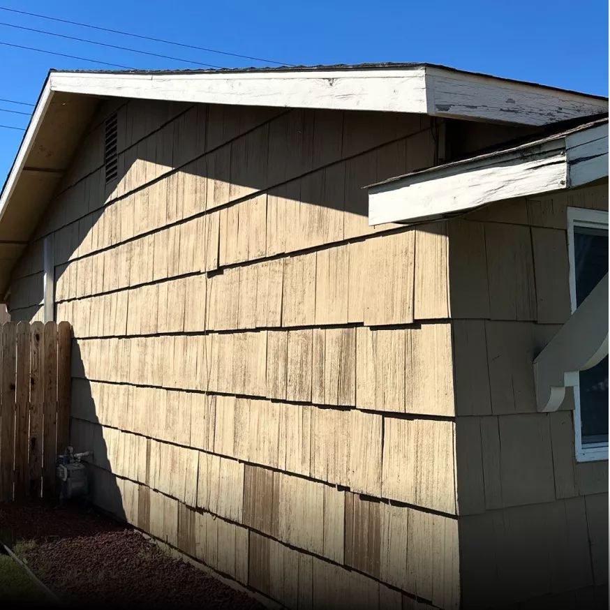 Home exterior before James Hardie siding replacement.