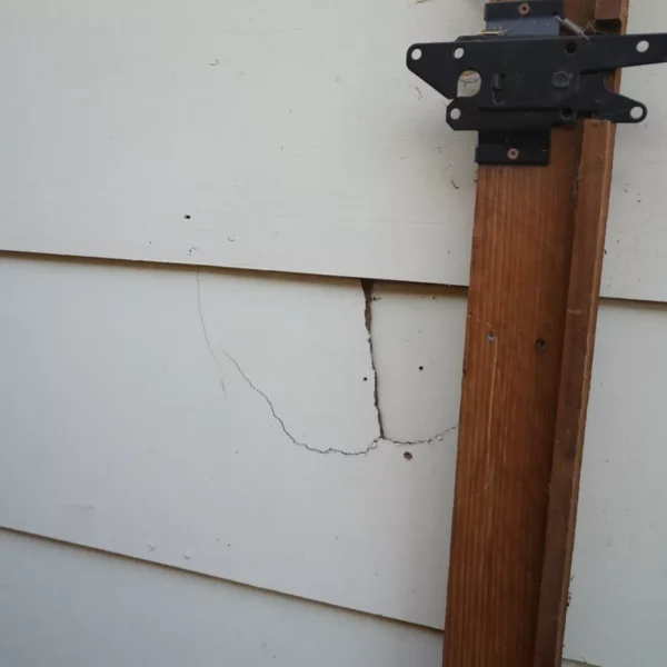 Close-up of the home's original siding and exterior details.