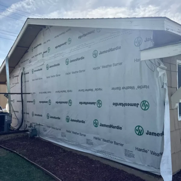 Exterior wall prepared for new James Hardie lap siding installation.