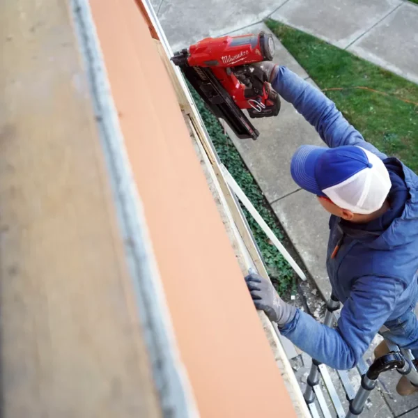 Old siding being torn off during exterior renovation.
