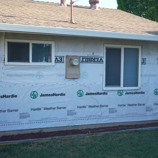 Old wood siding being removed from North Highlands residence.