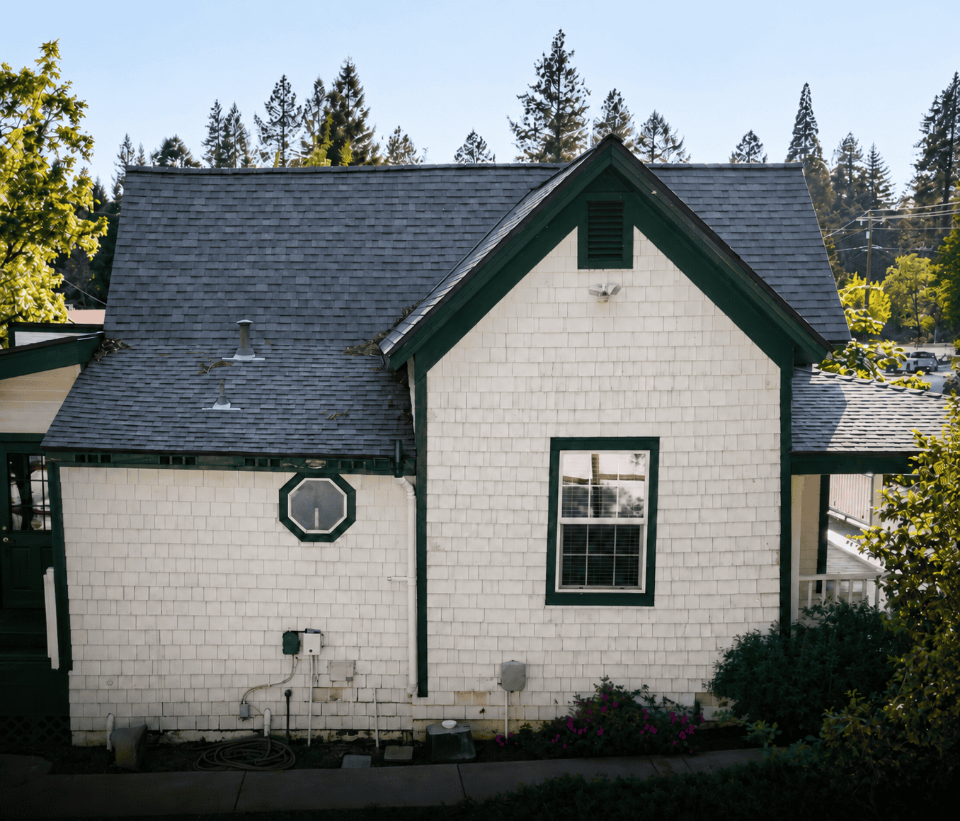 Home exterior after white and green James Hardie siding installation.
