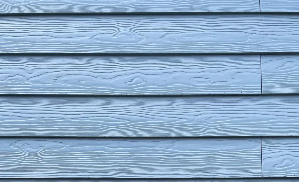 Close-up of fiber cement siding plank texture on wall
