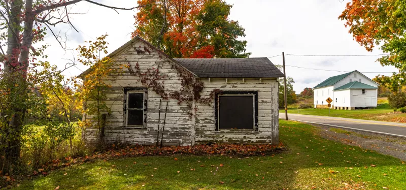 Older North Highlands home with deferred siding maintenance.