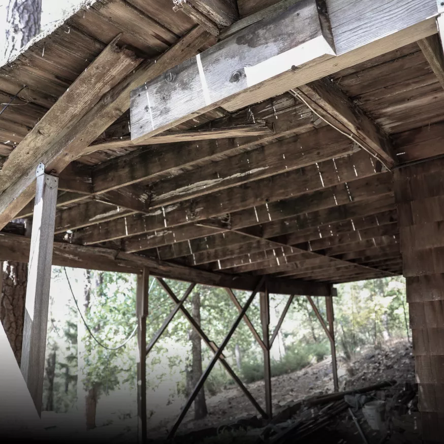 Applegate home with damaged wood deck before Trex replacement