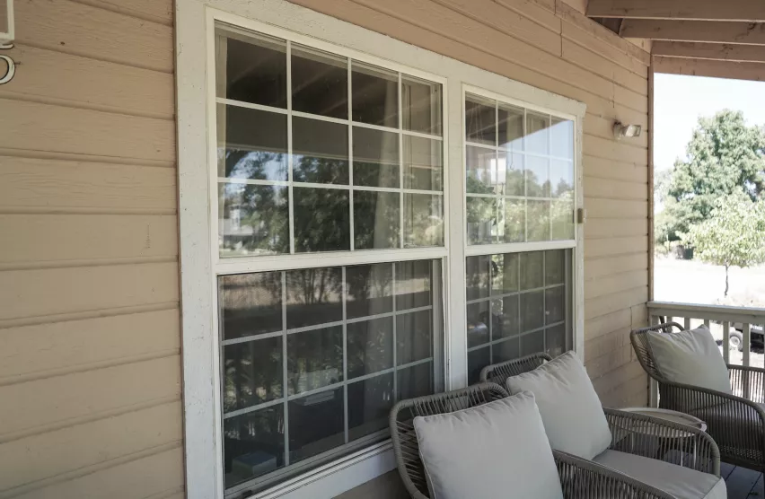 Roseville home porch window before replacement with aged frames and grids