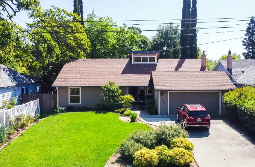 Elk Grove home before exterior remodeling with weathered siding and trim
