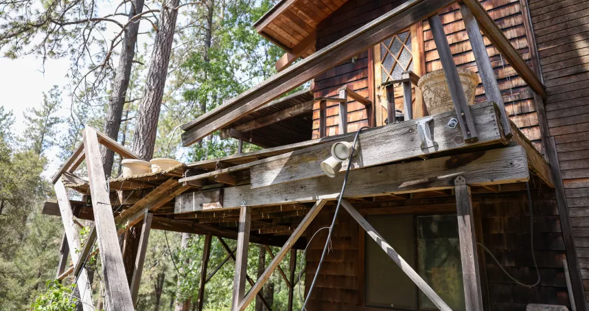 Old damaged wood deck at Applegate home before replacement