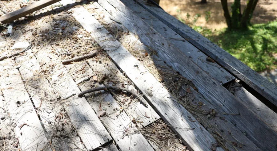 Damaged wooden deck being removed during Applegate deck replacement