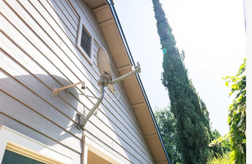 Elk Grove home exterior before remodeling with worn siding and trim