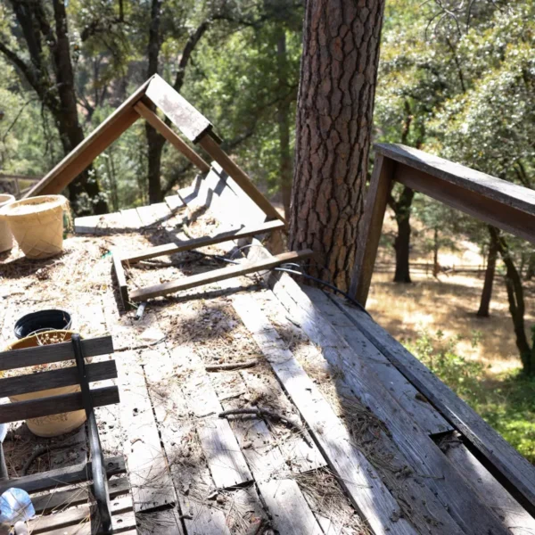 Existing wood deck being dismantled and removed