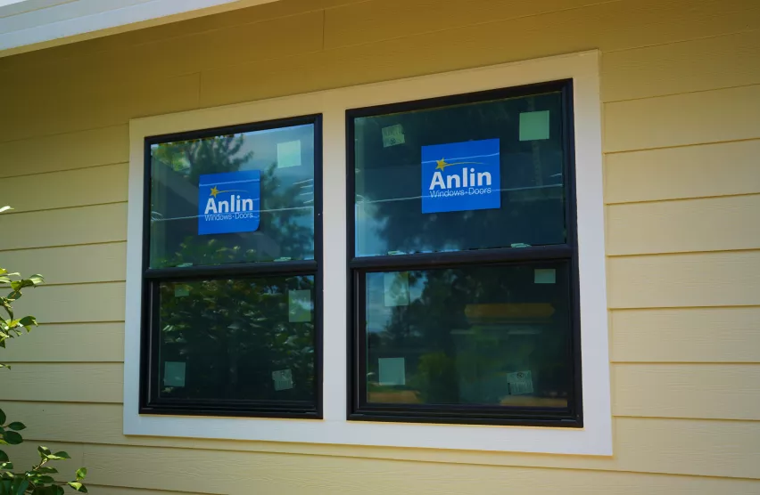 New black-frame Anlin double-hung windows installed on an Elk Grove home