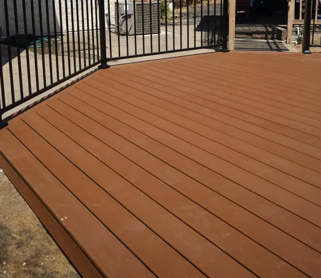 Finished small Trex composite deck creating a low-maintenance outdoor living area.