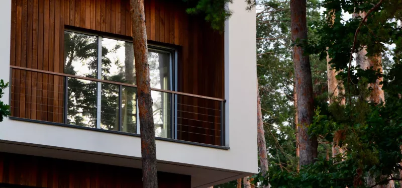 Contemporary Roseville home featuring large picture windows, black-framed casement windows, and modern glass designs