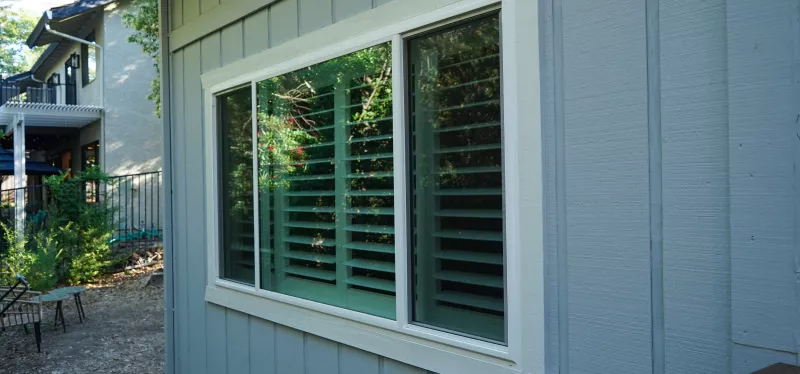 Large fixed picture window framing an outdoor view