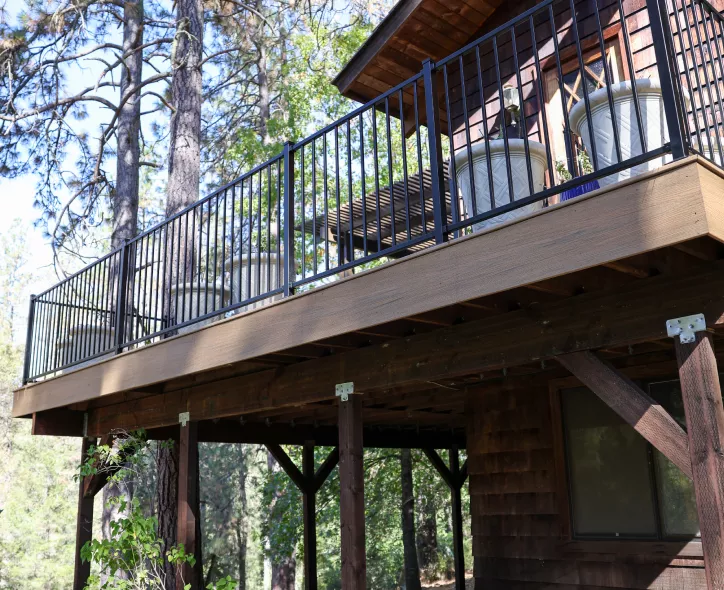 New Trex deck with black metal railing at Applegate home