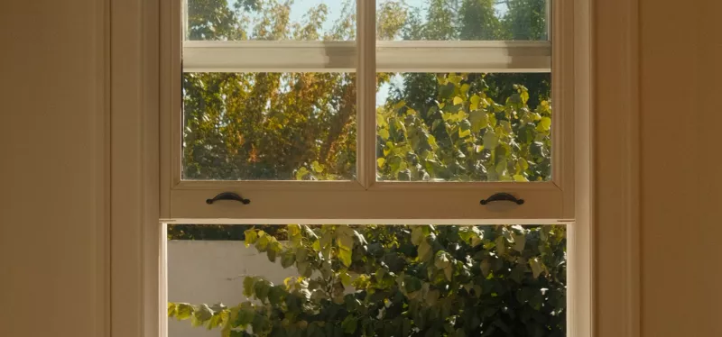 Double-hung window with two vertically sliding sashes