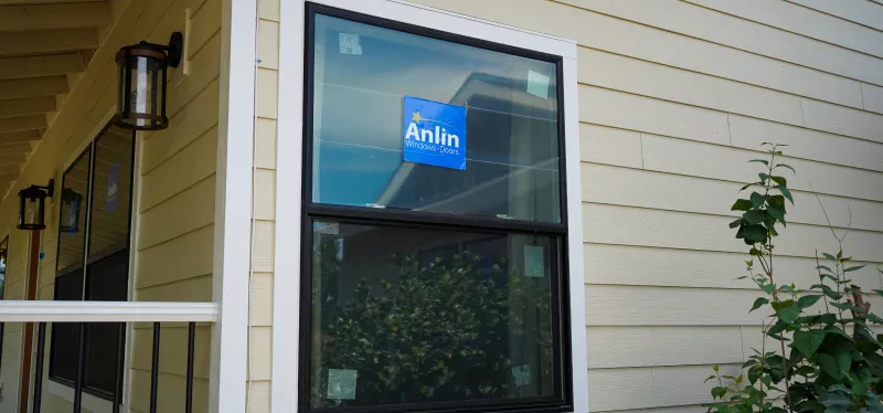 Double-hung window with two vertically sliding sashes