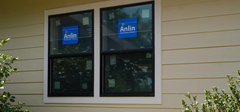 Single-hung and double-hung residential windows with vertical sliding sashes in a Sacramento home